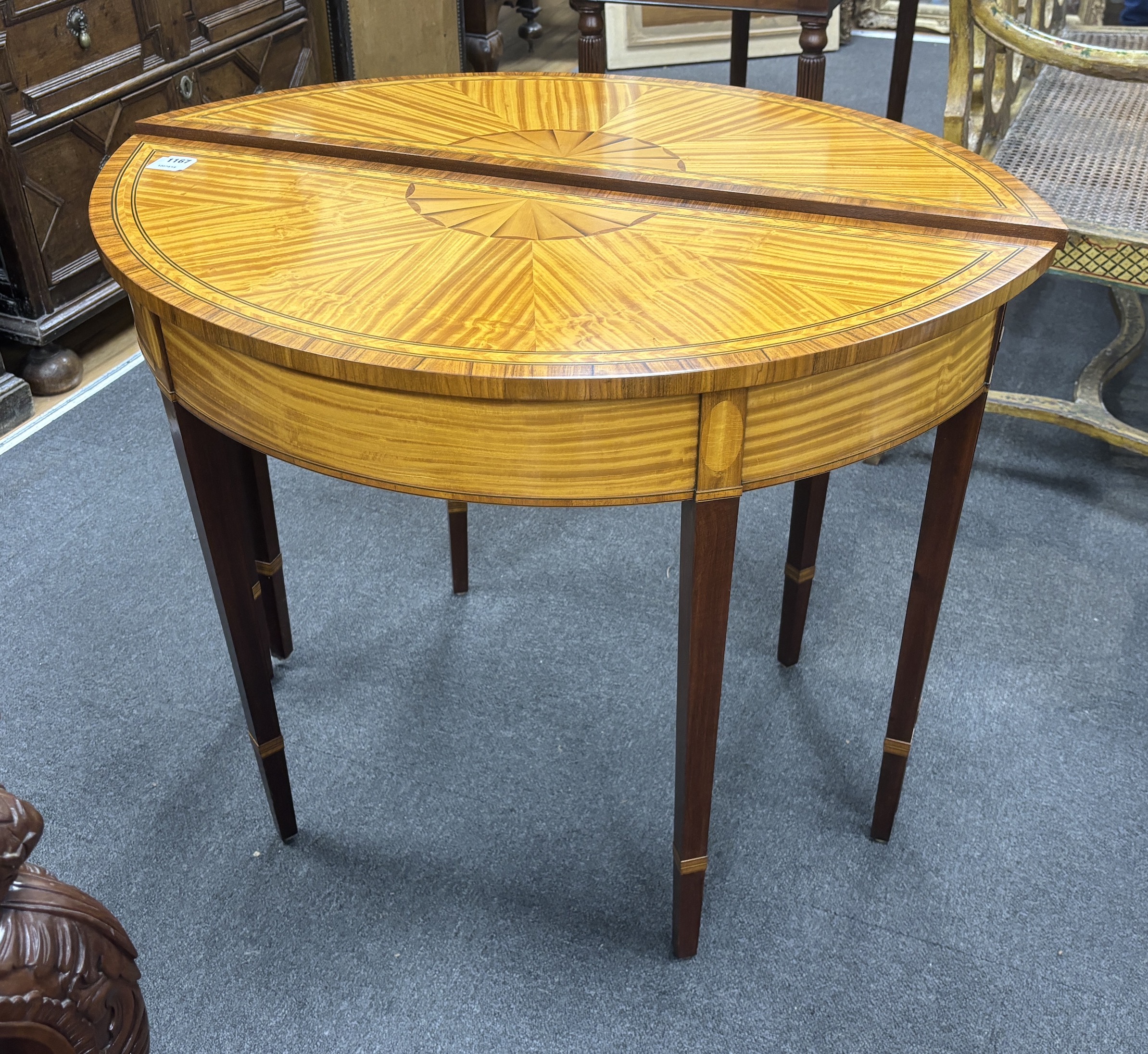 A pair of reproduction Sheraton style banded satinwood D shaped side tables, width 94cm, depth 39cm, height 73cm